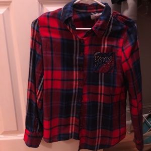 Flannel with gems on pocket.